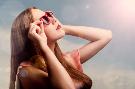 Summer portrait of a beautiful woman in sunglassesの写真素材