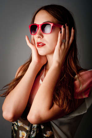 fashion shoot of beauty young girl with sunglassesの写真素材