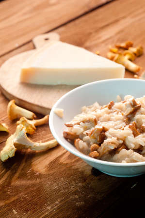 risotto with mushrooms on a wooden backgroundの写真素材