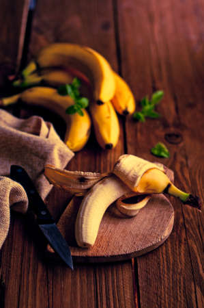 Fresh bananas on wooden backgroundの写真素材