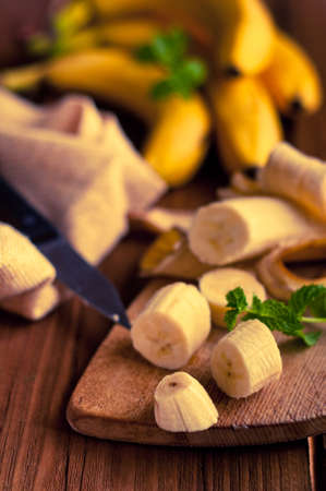 Fresh bananas on wooden backgroundの写真素材