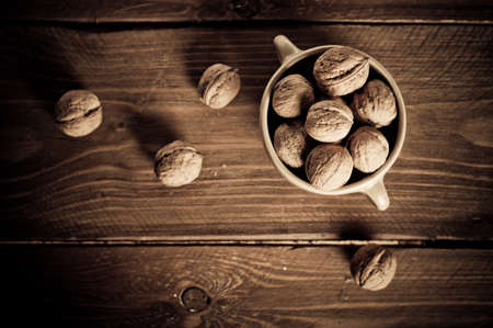 Walnuts on wooden boards. Vintage Retouch.の写真素材