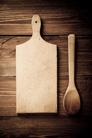 Empty vintage cutting board on planks food background conceptの写真素材