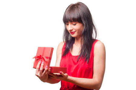 Beautiful brunette opens giftの写真素材