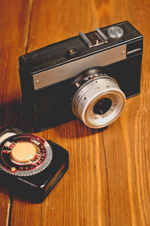 Vintage camera on wooden backgroundの写真素材
