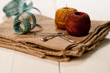 Sewing material with color threads, meter and scissors