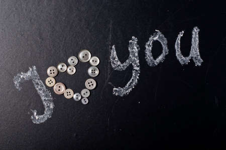 The heart lying on the blackboard, the concept of Valentine's Day.の写真素材