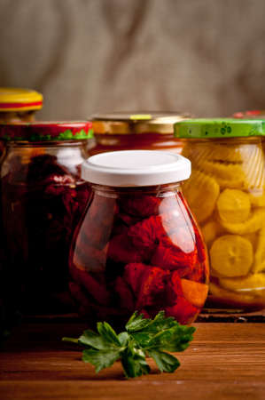 Composition with jars of pickled vegetables. Marinated food.の写真素材