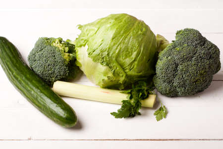 green vegetables on white boardsの写真素材