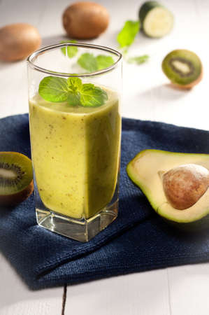 Green smoothie with avocado, kiwi, cucumber and mintの写真素材