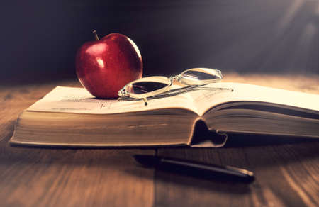 Old book on the wooden boards. Retouching Vintage, selective focus.の写真素材