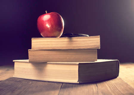 Old book on the wooden boards. Retouching Vintage, selective focus.の写真素材