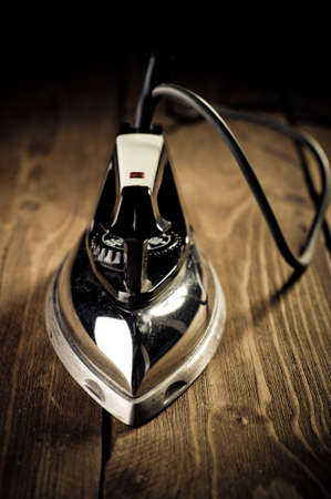 Old electric iron, touch-up in retro styleの写真素材