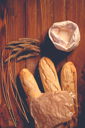 bread on wooden boards, touch-up in retro styleの写真素材