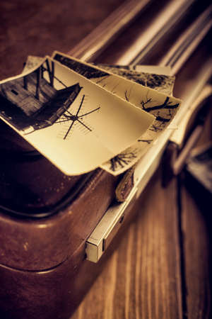 old photographs on an old suitcaseの写真素材