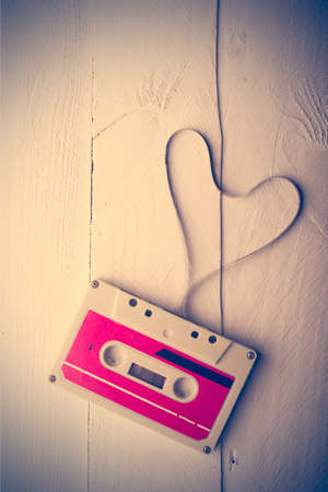Audio cassette tape in the shape of heart. Retouching vintage.の写真素材