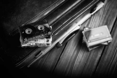 Cassette tape lying on an old suitcase. Vintage Retouchingの写真素材