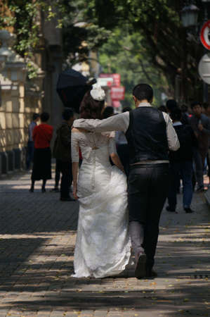 wedding Couples walking on the streetの写真素材