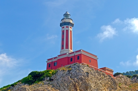 Red Lighthouse seen on the island of Capri, Italy, shot from a boatの写真素材