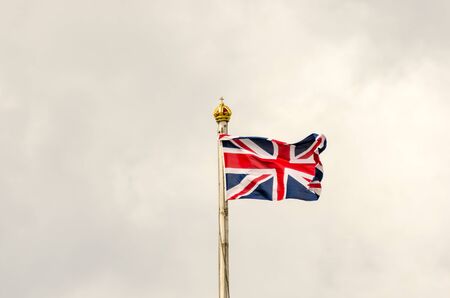 Union Jack Flag flying on a cloudy dayの写真素材