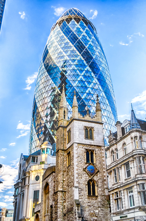 LONDON - MAY 29: The Gherkin building (30 St Mary Axe) in London on May 29, 2015. Iconic landmark of London, this is one of the city's most widely recognized examples of modern architecture.のeditorial素材