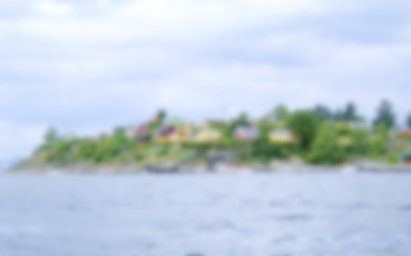 Defocused Background of the shore on the Oslo fjord in Norway. Intentionally blurred post production for bokeh effectの写真素材