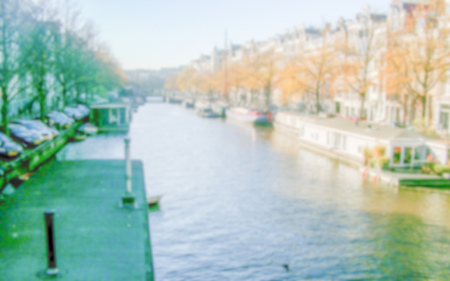 Defocused Background with Canal in Amsterdam, The Netherlands. Intentionally blurred post production for bokeh effectの写真素材