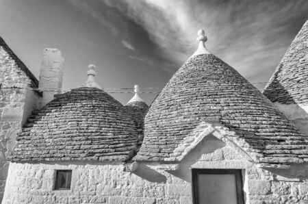 Typical trulli buildings with conical roofs in Alberobello, Apulia, Italyの写真素材