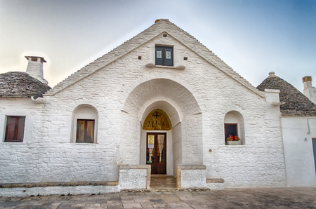 Typical trulli buildings with conical roofs in Alberobello, Apulia, Italyの写真素材