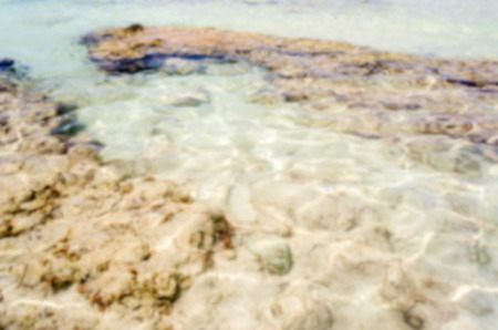 Defocused background of white sandy beach in Salento, Italy. Intentionally blurred post production for bokeh effectの写真素材