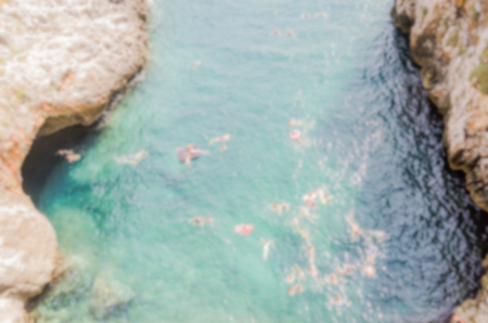 Defocused background of scenic seascape at Ciolo Bridge, Apulia, Italy. Intentionally blurred post production for bokeh effectの写真素材