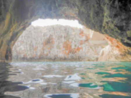 Defocused background of scenic seascape at Ciolo Bridge, Apulia, Italy. Intentionally blurred post production for bokeh effectの写真素材