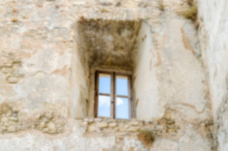 Defocused background with ancient window of an old castle. Intentionally blurred post production for...