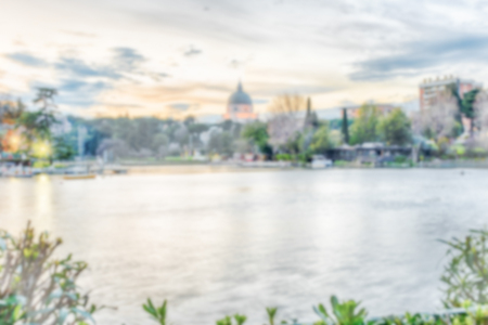 Defocused background with scenic view over the lake of EUR in Rome, Italy. Intentionally blurred post production for bokeh effectの写真素材