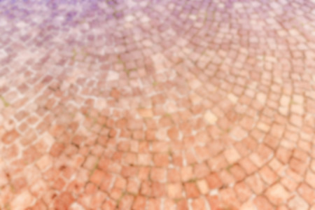 Defocused background of Sampietrini cobblestone pavement in Rome, Italy. Intentionally blurred post production for bokeh effectの写真素材