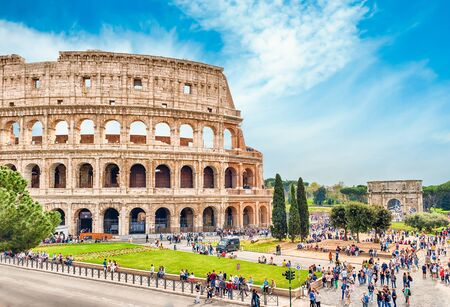 ROME - APRIL 2, 2016 - Tourists walking by the Colosseum in Rome, April 2, 2016. The Colosseum is an iconic symbol of Imperial Rome. In 2007 the complex was included among the New7Wonders of the Worldのeditorial素材