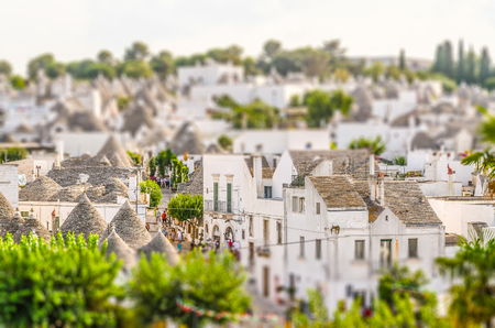Scenic panoramic view of Alberobello town and its typical trulli buildings, Apulia, Italy. Tilt-shift effect appliedの写真素材