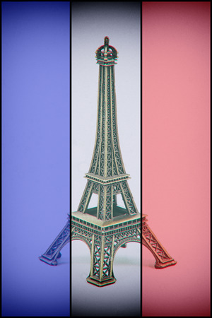 Eiffel Tower model on french flag. Dust and scratches applied for vintage analog effectの写真素材