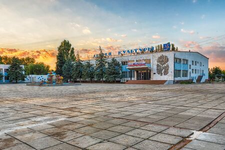 FRUNZE, CRIMEA - AUGUST 25, 2016: Palace of Culture in the central square of Frunze, a small village in Crimea. The building shows a poster celebrating  the result of the 2014 annexation of Crimea by Russiaのeditorial素材