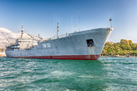 SEVASTOPOL, CRIMEA - AUGUST 24, 2016: Soviet and Russian Black Sea Fleet warships, standing in the quay of the Sevastopol bay, Crimeaのeditorial素材