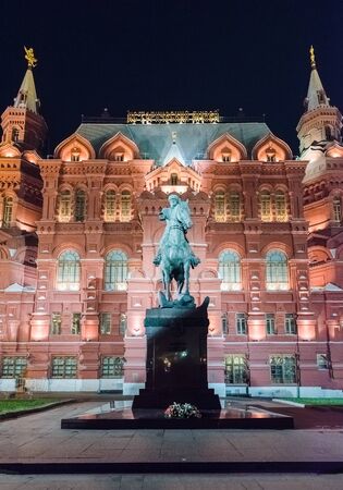 The State Historical Museum and Marshal Zhukov statue at night, Moscow, Russiaのeditorial素材