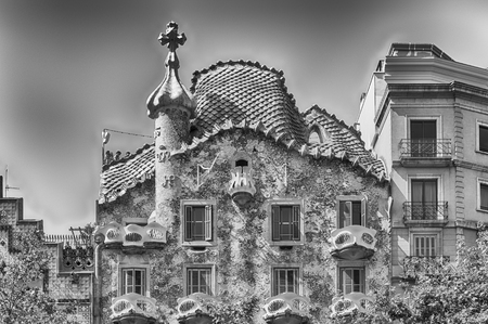 BARCELONA - AUGUST 9: Facade and Dragon's tile rooftop of Casa Batllo, renowned building designed by Antoni Gaudi and iconic landmark in Barcelona, Catalonia, Spain, on August 9, 2017のeditorial素材