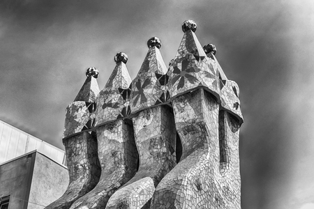 BARCELONA - AUGUST 9: Mosaic tile chimneys of Casa Batllo, renowned building designed by Antoni Gaudi and iconic landmark in Barcelona, Catalonia, Spain, on August 9, 2017のeditorial素材