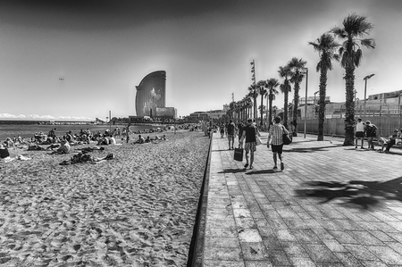 BARCELONA - AUGUST 10: People enjoying a sunny day on La Barceloneta beach, Barcelona, Catalonia, Spain, on August 10, 2017のeditorial素材