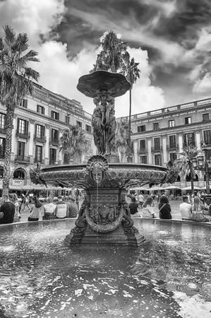 BARCELONA - AUGUST 8: Scenic fountain in Placa Reial, sightseeing and iconic square of the Gothic Quarter in Barcelona, Catalonia, Spain, on August 8, 2017のeditorial素材