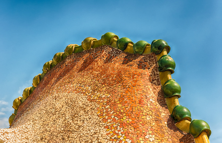 BARCELONA - AUGUST 9: The iconic Dragon's spine roof arch of Casa Batllo, renowned building designed by Antoni Gaudi and iconic landmark in Barcelona, Catalonia, Spain, on August 9, 2017のeditorial素材