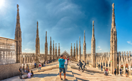 MILAN - SEPTEMBER 11: Tourists on the roof terrace of the gothic Cathedral, iconic landmark of Milan, Italy, September 11, 2017のeditorial素材