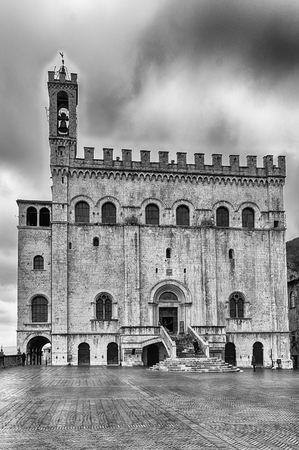View of Palazzo dei Consoli, a medieval building facing the scenic Piazza Grande in Gubbio, Umbria, central Italy. It is house to the local Civic Museumのeditorial素材