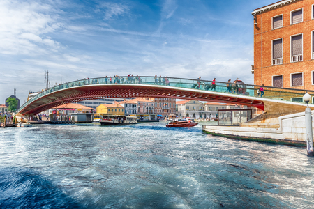 VENICE, ITALY - APRIL 29: Tourists walking on the controversial Constitution Bridge in Venice, Italy on April 29, 2018. Designed by the starchitect Santiago Calatrava, the bridge opend in 2008のeditorial素材