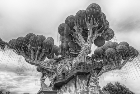 CASTELNUOVO DEL GARDA, ITALY - MAY 1: Giant tree inside Gardaland Amusement Park, near Lake Garda, Italy, May 1, 2018. The park attracts nearly 3 million visitors every yearのeditorial素材